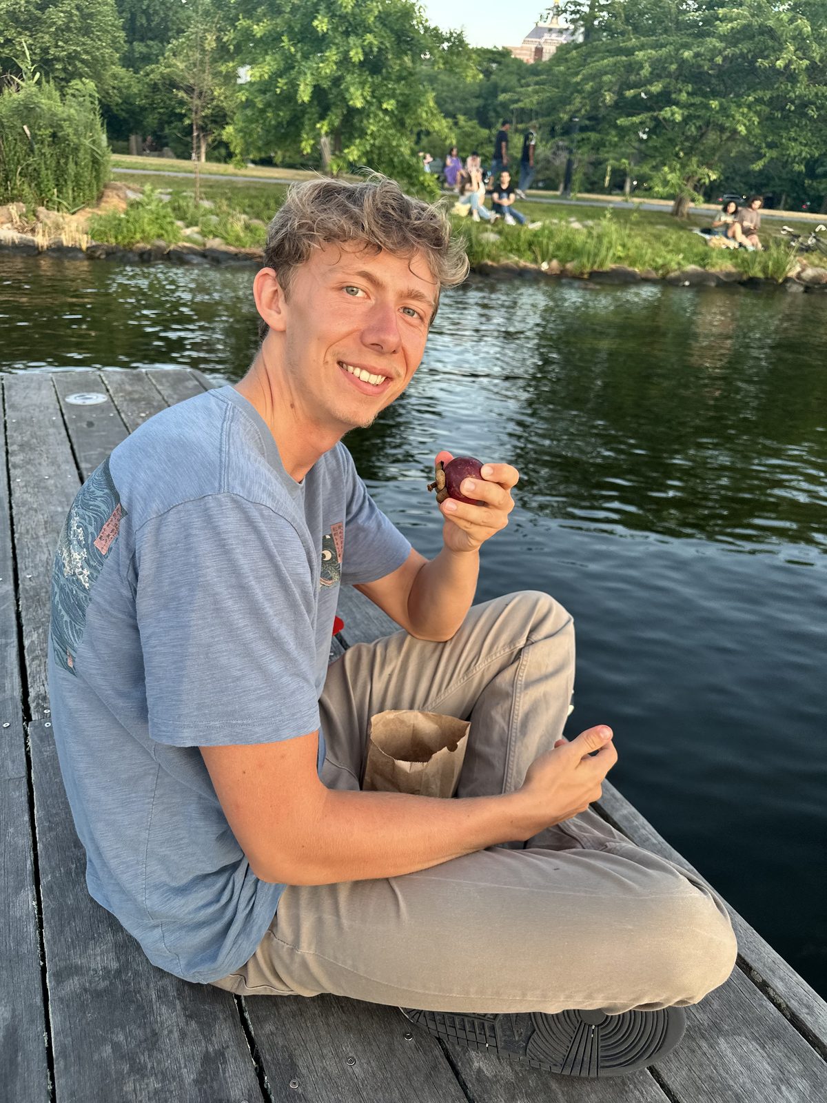 Blaze eating mangosteen by the water